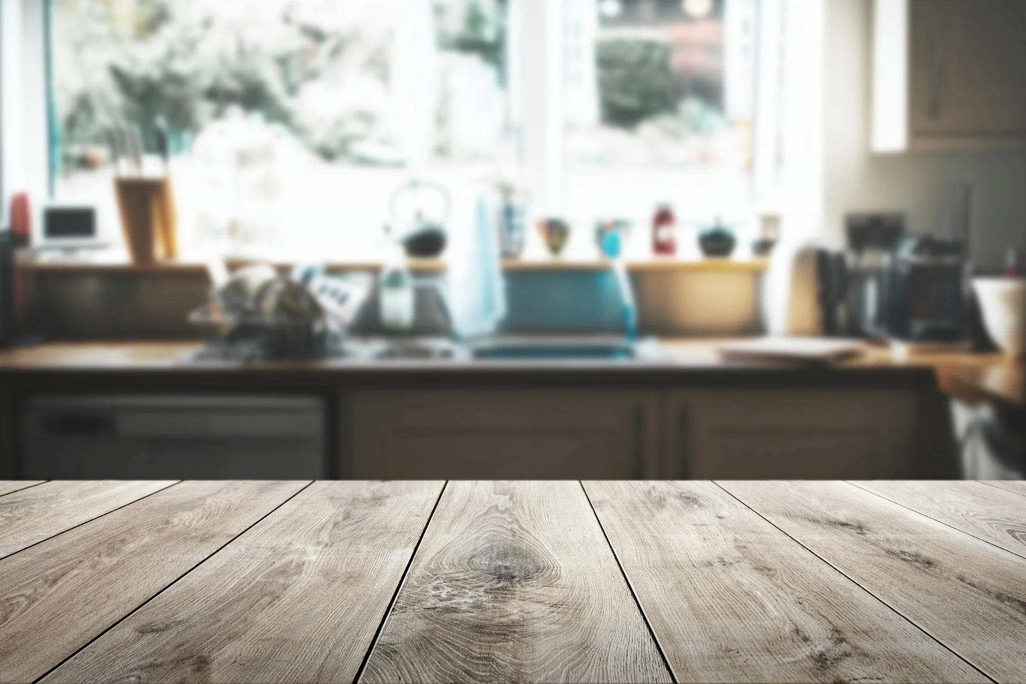 Wooden counter by a kitchen window